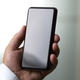 Look at the edges of the screen on one of Corning’s test devices; it looks way beefier than a normal phone.